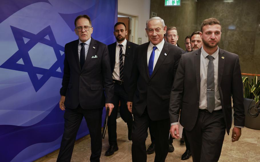 Israeli Prime Minister Benjamin Netanyahu, center, arrives for a weekly cabinet meeting at the Prime Minister’s office in Jerusalem on Sunday, Jan. 15, 2023.
