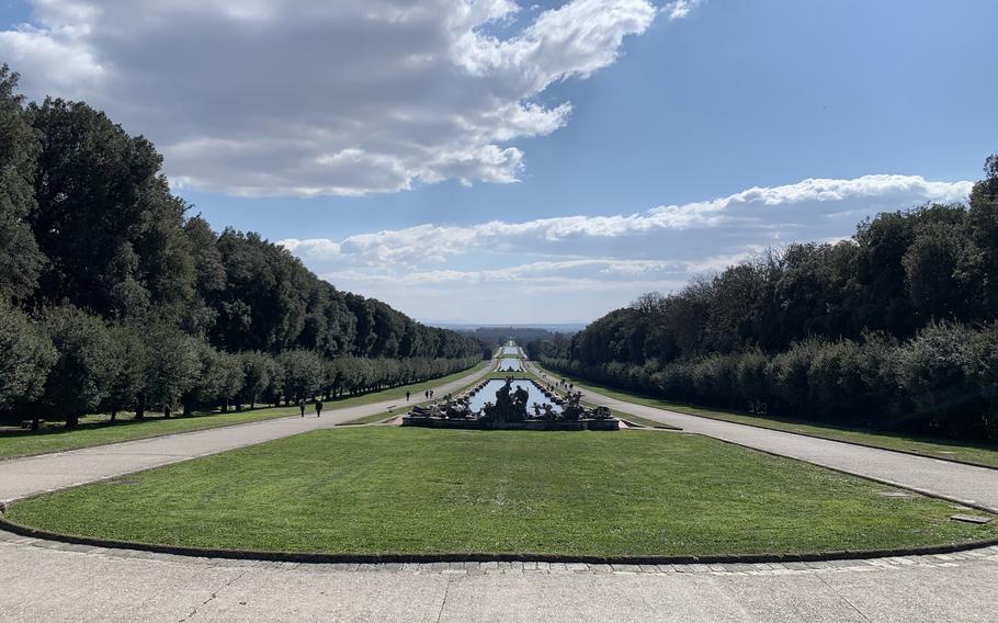 The Royal Palace of Caserta near Naples, Italy, is visible in the background of this view from the Royal Park's waterway.