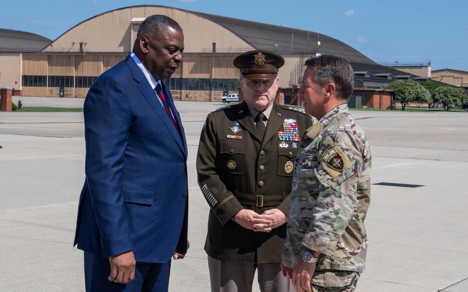 Defense Secretary Lloyd Austin and Army Gen. Mark Milley, chairman of the Joint Chiefs of Staff, greet Army Gen. Austin Miller as he returns to the U.S. from Afghanistan at Joint Base Andrews, Md., on July 14, 2021. 