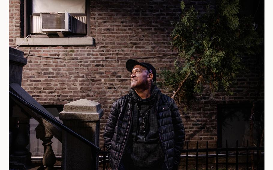 Jose Marquez stands outside of his building, after his return to the United States.