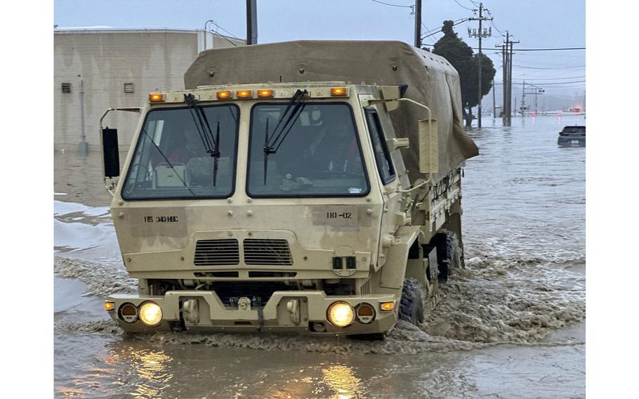 California National Guard Soldiers support local first responders in rescue operations due to flooding in Monterey County, California, on March 11, 2023. 