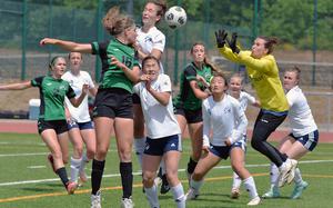 The ball flies past friend and foe in front of the Black Forest Academy goal during Division II final action at the DODEA-Europe soccer championships in Ramstein, Germany, May 22, 2025. Naples beat BFA 3-0 to take the division title.