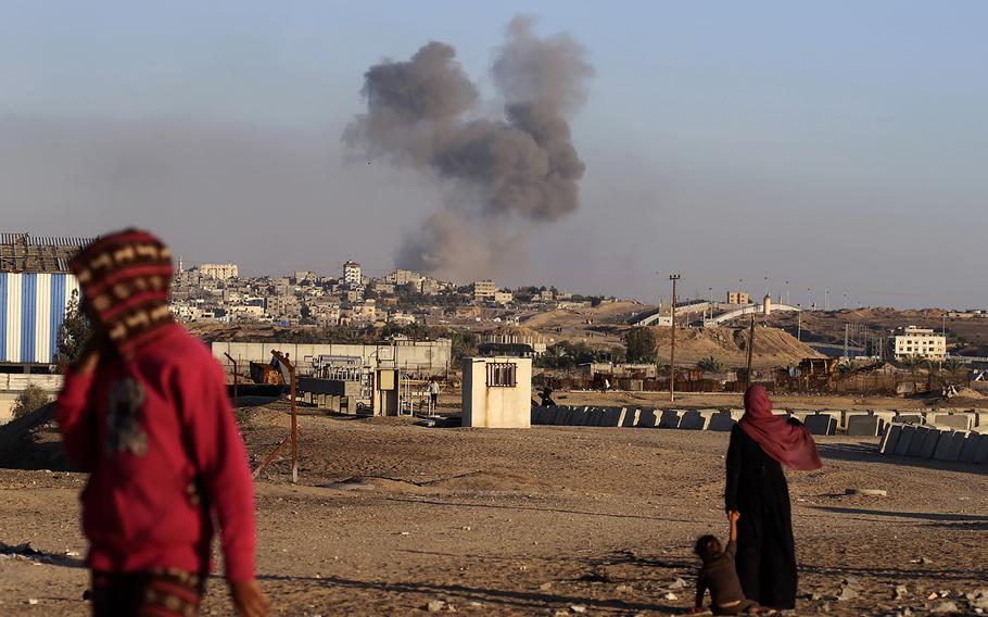 Smoke rises over Gaza following an Israeli airstrike on buildings near the separating wall between Egypt and Rafah on May 7, 2024.