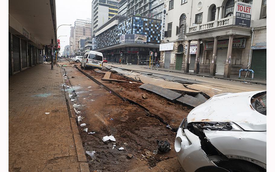 A general view of a damaged road in Johannesburg on July 20, 2023, following an unexplained explosion which occurred during rush hour on July 19, 2023. 