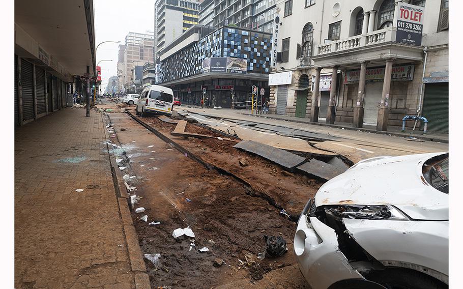 A general view of a damaged road in Johannesburg on July 20, 2023, following an unexplained explosion which occurred during rush hour on July 19, 2023. 