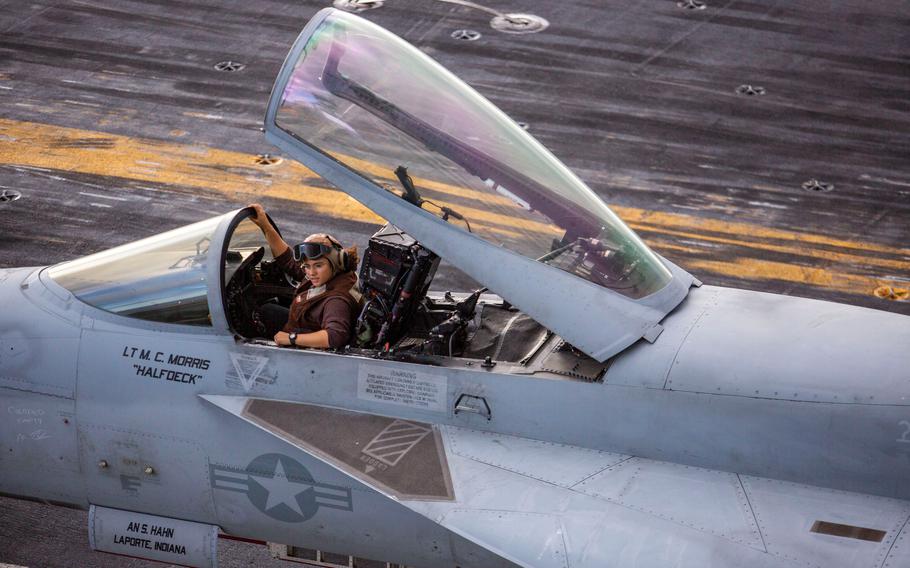 A pilot sits in the cockpit of a jet in between flight operations on the flight deck of the USS Gerald R. Ford CVN-78 on Friday, Oct. 7, 2022.
