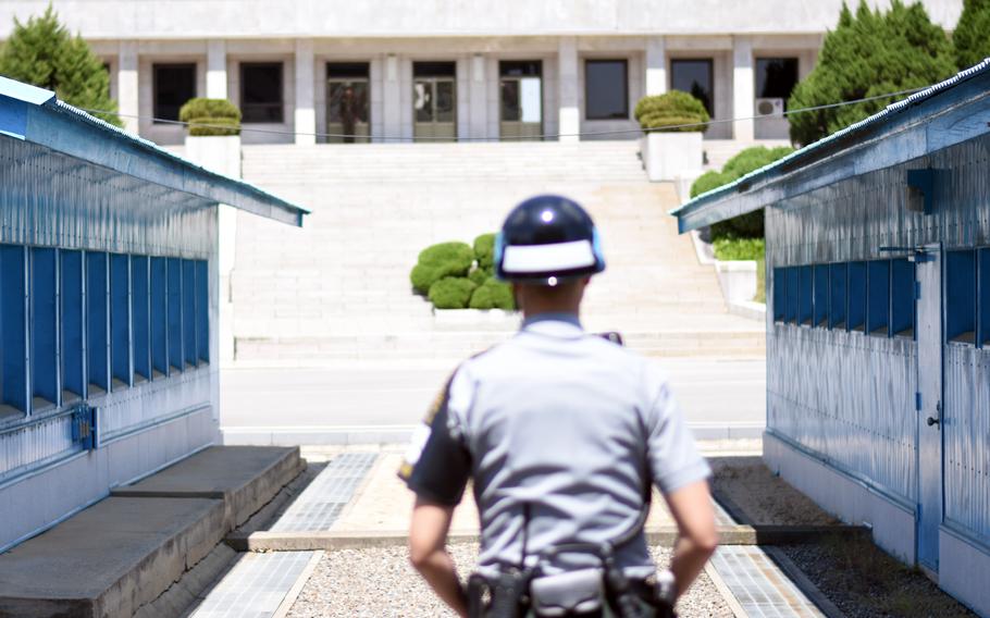 North and South Korean soldiers face off at the Joint Security inside the Demilitarized Zone, May 24, 2017. 