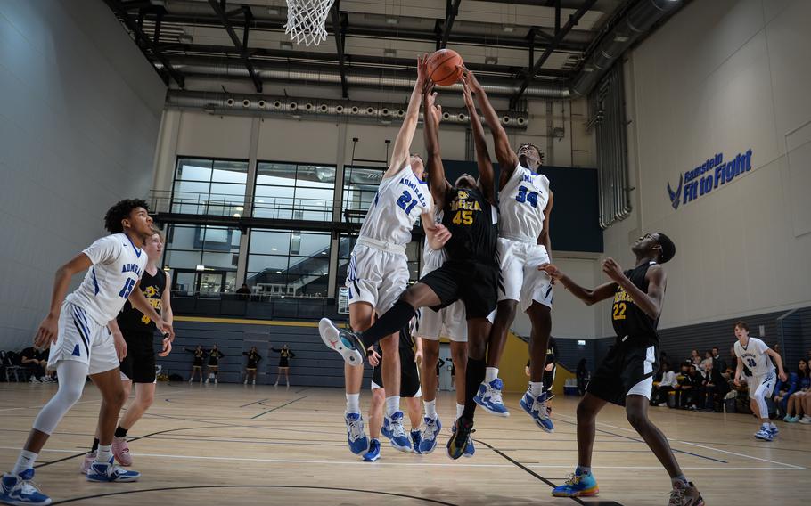 Vicenza’s Joe Kelly battles Rota’s Tyler DeMeritt, left, and Brian Leiba during the DODEA-Europe Division II boys basketball tournament Wednesday, Feb. 15, 2023, at Ramstein Air Base. 