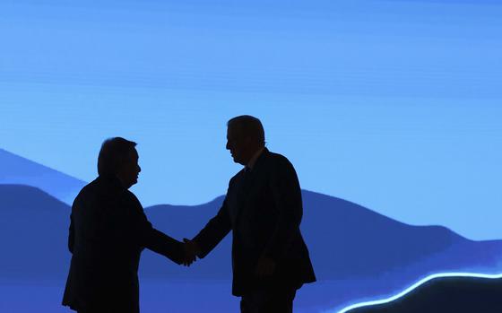 U.N. Secretary-General António Guterres shakes hands with former U.S. Vice President Al Gore during a COP27 event in Sharm El-Sheikh, Egypt.