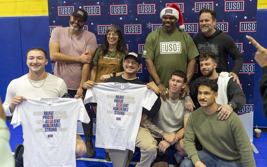 Hunter Hill, Melissa Villasenor, Charles Esten and Vince Wilfork take photos with personnel