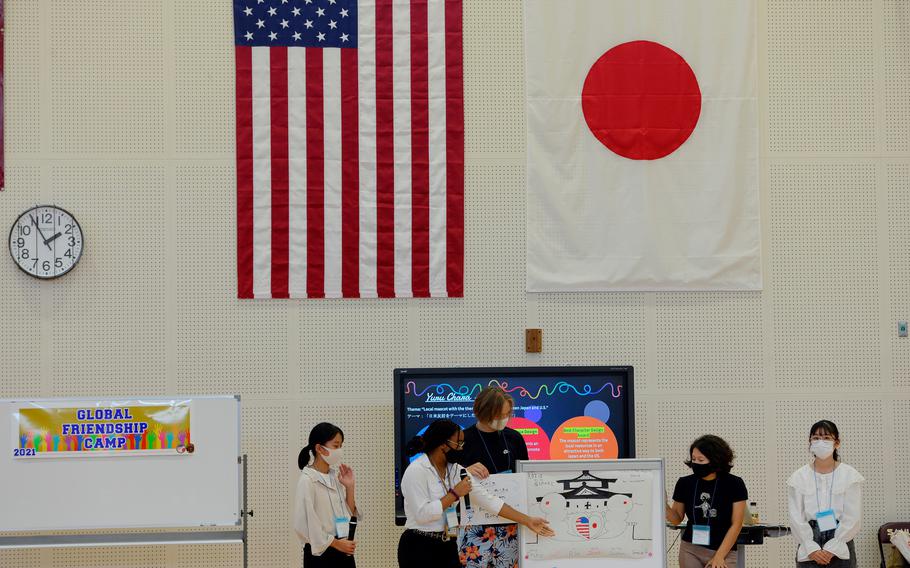 American and Japanese students present their project during a cultural-exchange camp at Matthew C. Perry High School on Marine Corps Air Station Iwakuni, Japan, Sunday, Oct. 3, 2021. 