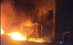 This image from video provided by Mikey B shows a fire near a New Jersey chemical plant, Friday, Jan. 14, 2022 in Passaic, N.J. A fire at a New Jersey chemical plant with flames and smoke visible for miles in the night sky Friday has spread to multiple buildings, threatening to reach the plant's chemical storage area, authorities said.