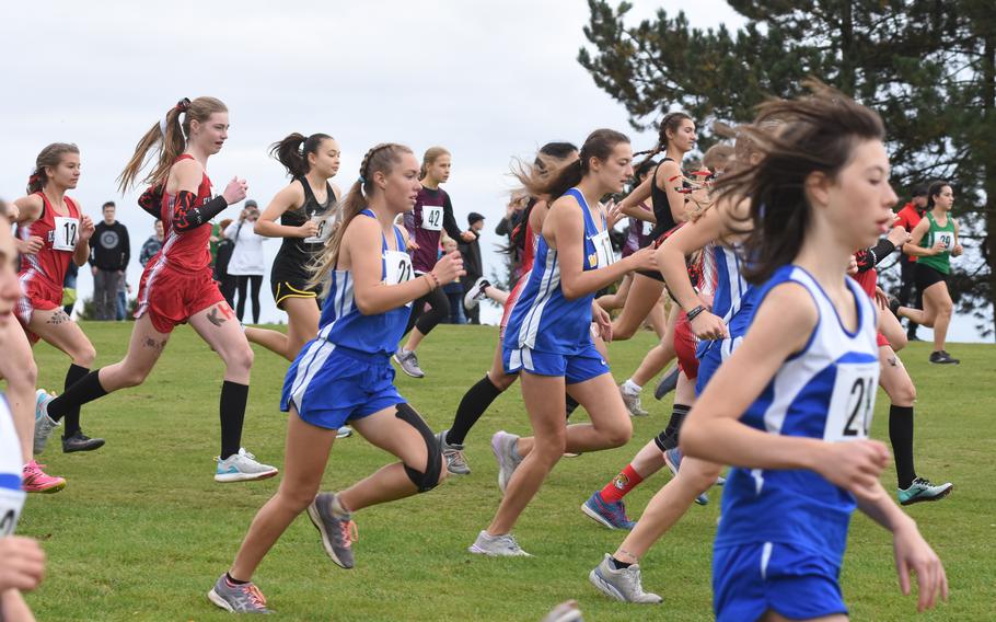 Runners sprint at the start of the girls’ large school division race at the DODEA-Europe cross country championships on Saturday, Oct. 23, 2021. The race was held at the Baumholder Rolling Hills Golf Course for teams north of the Alps. Four races were held and individual and team titles were handed out for the first time in two years due to the pandemic.