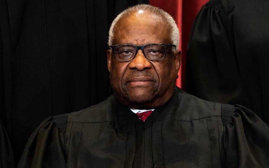 Associate Justice Clarence Thomas sits during a group photo of the Justices at the Supreme Court in Washington, DC on April 23, 2021. The Obergefell same-sex marriage case was one of several cited by Justice Clarence Thomas in a lone concurring opinion Friday as precedents the Supreme Court should also overturn after ruling Roe v. Wade was flawed. 