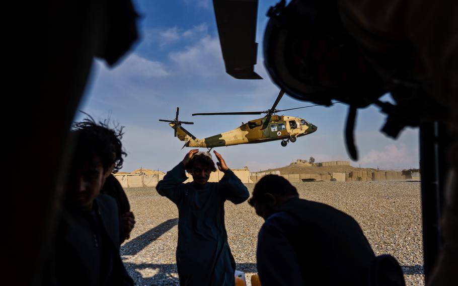 During a resupply mission, a second UH-60 Blackhawk arrives an outpost in the Shah Wali Kot district north of Kandahar, Afghanistan.