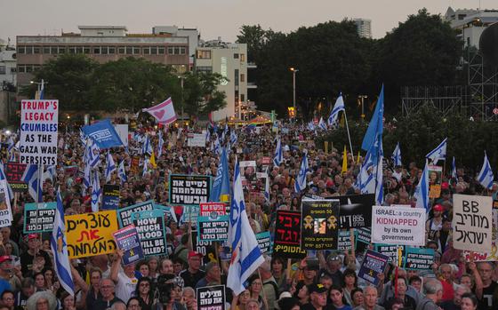People attend a rally calling for the end of the war and the immediate release of hostages held by Hamas in the Gaza Strip, as they gather in Tel Aviv, Israel, Thursday, July 24, 2025. (AP Photo/Ariel Schalit)