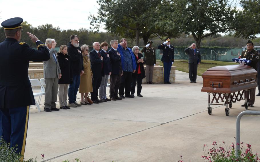 The family of Pfc. Clinton Edward Smith stands to honor the fallen soldier during a funeral service at Fort Sam Houston National Cemetery in San Antonio, Texas, on Nov. 27, 2023. 