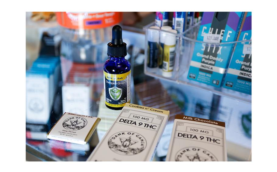 Chocolate bars containing delta-9 THC and a bottle of BattleBuds CBD tincture, Champion Drops, at BattleBuds on March 13, 2024, in Tampa.