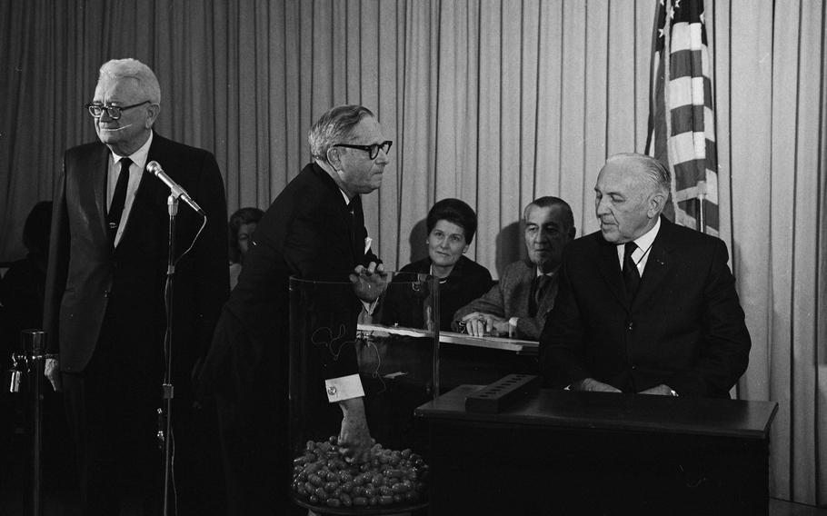 Congressman Alexander Pirnie (R-NY) drawing the first capsule for the Selective Service draft, Dec 1, 1969.