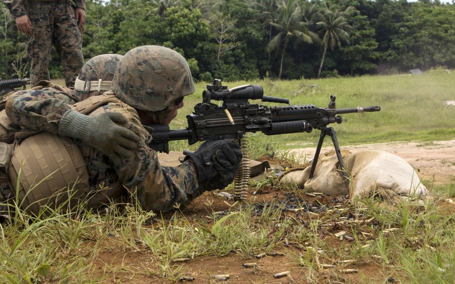 A Marine fires an M249 light machine gun during training at Andersen Air Force Base, Guam, Sept. 1, 2017. 