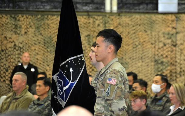 Guardians stand at attention after unveiling the U.S. Space Forces Korea flag at Osan Air Base, South Korea, Wednesday, Dec. 14, 2022. 
