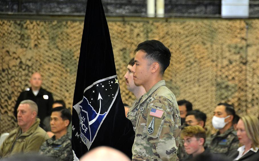 Guardians stand at attention after unveiling the U.S. Space Forces Korea flag at Osan Air Base, South Korea, Wednesday, Dec. 14, 2022. 