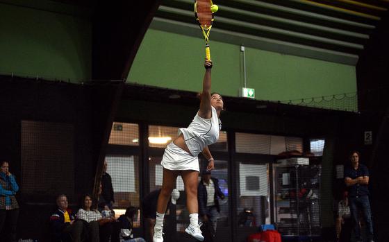 Sigonella's Charlize Caro serves during a girls singles semifinal match against Vicenza's Delia Gordon during the DODEA European tennis championships on Oct. 20, 2023, at T2 Sports Health Club in Wiesbaden, Germany.