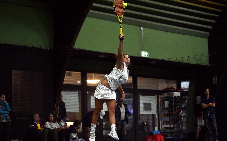 Sigonella's Charlize Caro serves during a girls singles semifinal match against Vicenza's Delia Gordon during the DODEA European tennis championships on Oct. 20, 2023, at T2 Sports Health Club in Wiesbaden, Germany.