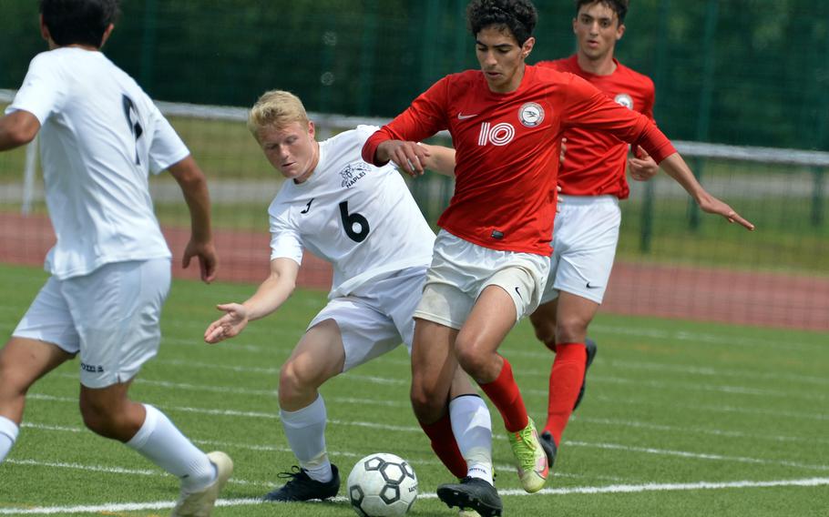 Naples’ Henri Schneider tries to separate AOSR’s Zane El Kilany from the ball in the boys Division II final at the DODEA-Europe soccer championships in Kaiserslautern, Germany, May 19, 2022. Naples defeated their Italy rivals 1-0.
