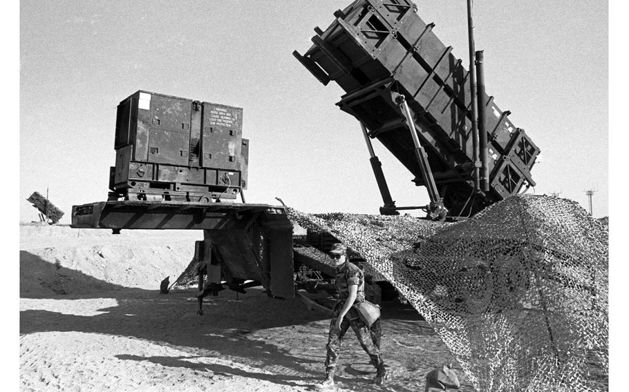 A Patriot missile battery in the Saudi Arabian desert stands ready to fight off an attack by Saddam Hussein’s Scud missiles during Operation Desert Shield in December 1990. 