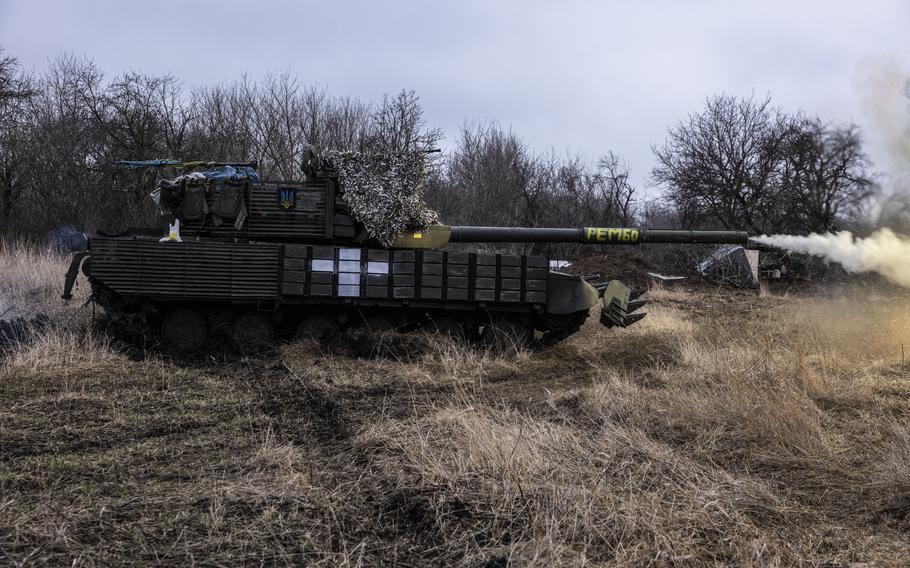 Ukraine soldiers test-fire a T-64 tank in a field in the Donetsk region on March 19, 2023.
