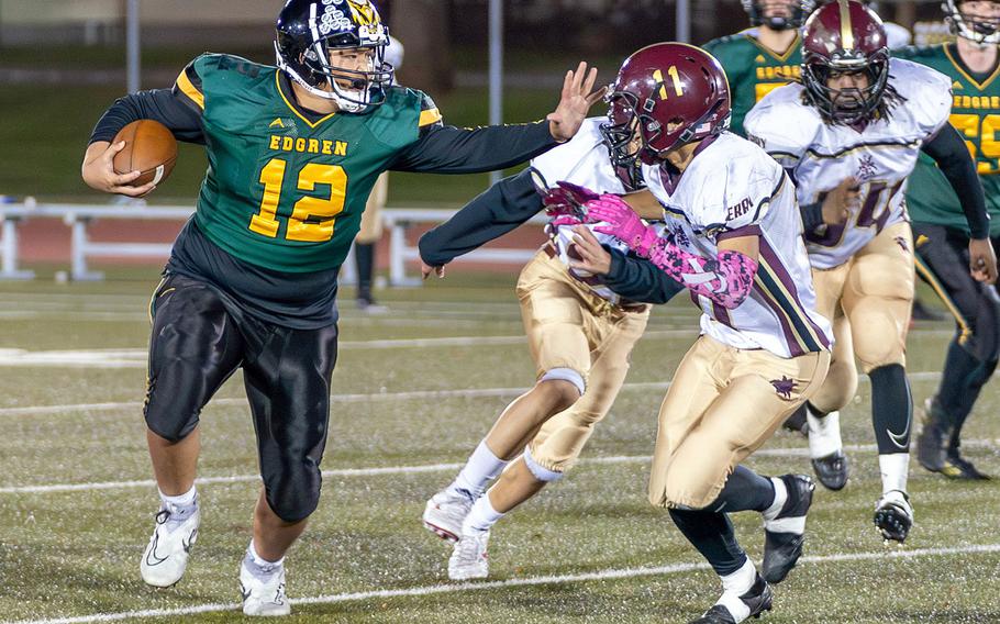 Robert D. Edgren's Jayse Ulechong stiff arms Matthew C. Perry defenders.