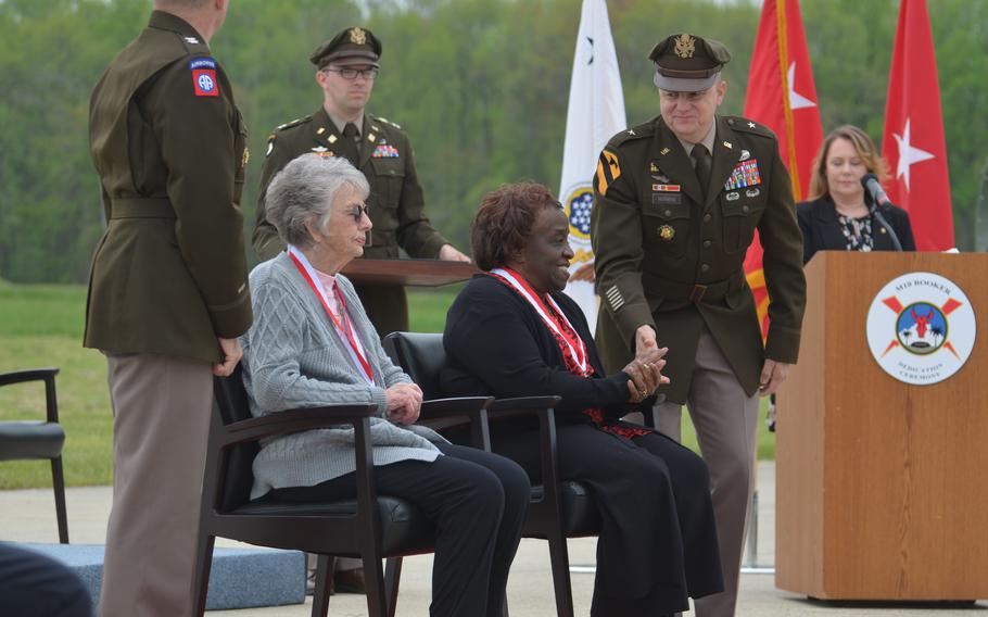 Rose Hirsch, sister of Pvt. Robert D. Booker, and Freddie Jackson, mother of Staff Sgt. Stevon A. Booker, receive the Silver Medallion of the Order of Saint George for both soldiers posthumously Thursday, April 18, 2024, at Aberdeen Proving Ground, Md. The Army held a dedication ceremony for the service’s new combat vehicle, the M10 Booker, named after both men.