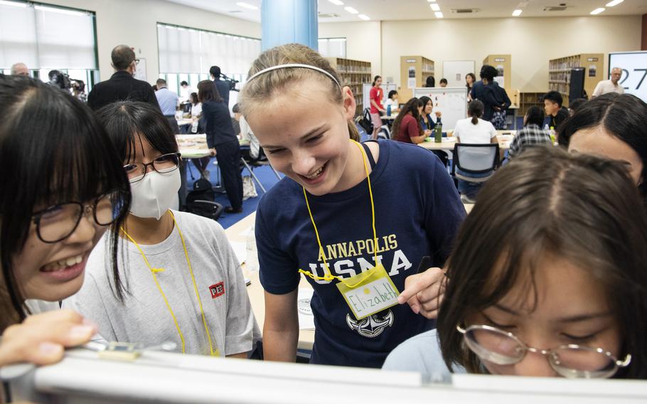 American and Japanese students work together during the Student Educational Exchange and Dialogue camp at Matthew C. Perry High School, Marine Corps Air Station Iwakuni, Japan, Sept. 23, 2023. 