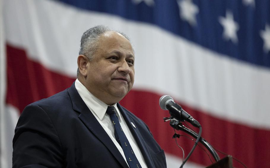 Secretary of the Navy Carlos Del Toro speaks on stage during a change of command ceremony where Douglas Perry was promoted to vice admiral aboard the aircraft carrier USS Harry S. Truman at Naval Station Norfolk on Jan. 12, 2024.