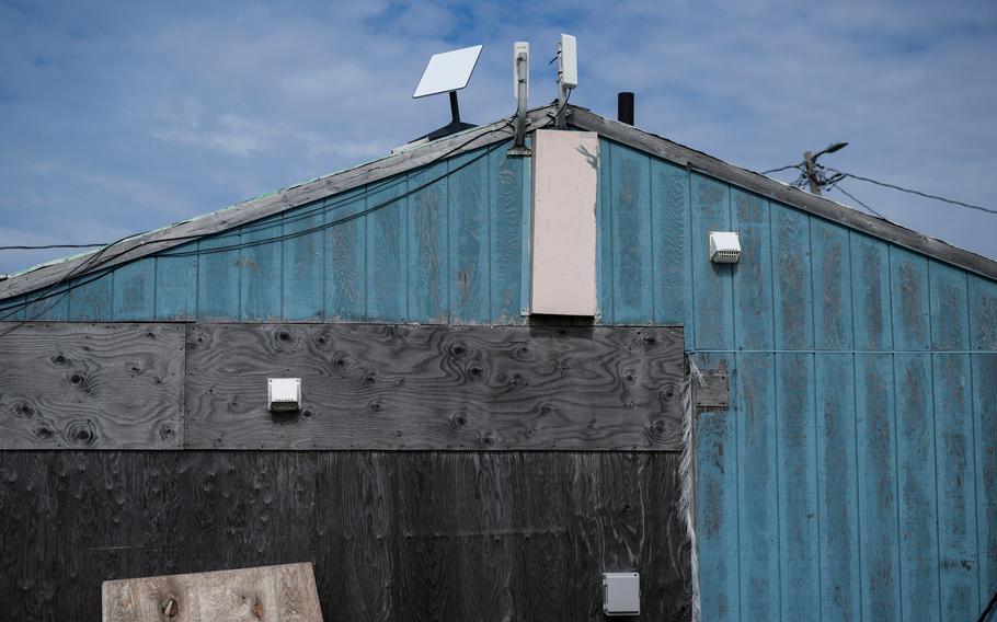 Starlink satellite internet equipment is mounted to a home in Eek, a village in Southwest Alaska, on Aug. 2, 2023. 