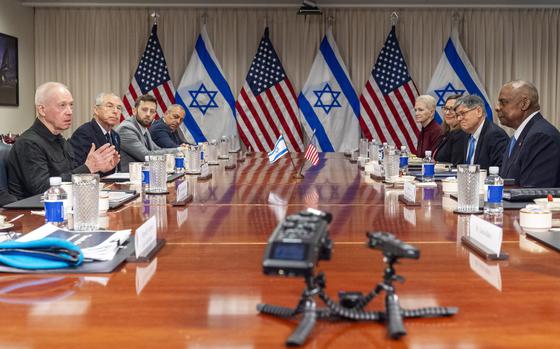Israeli Defense Minister Yoav Gallant, at far left, speaks while meeting with Defense Secretary Lloyd Austin, across table at far right, at the Pentagon, Tuesday, March 26, 2024, in Washington. (AP Photo/Jacquelyn Martin)