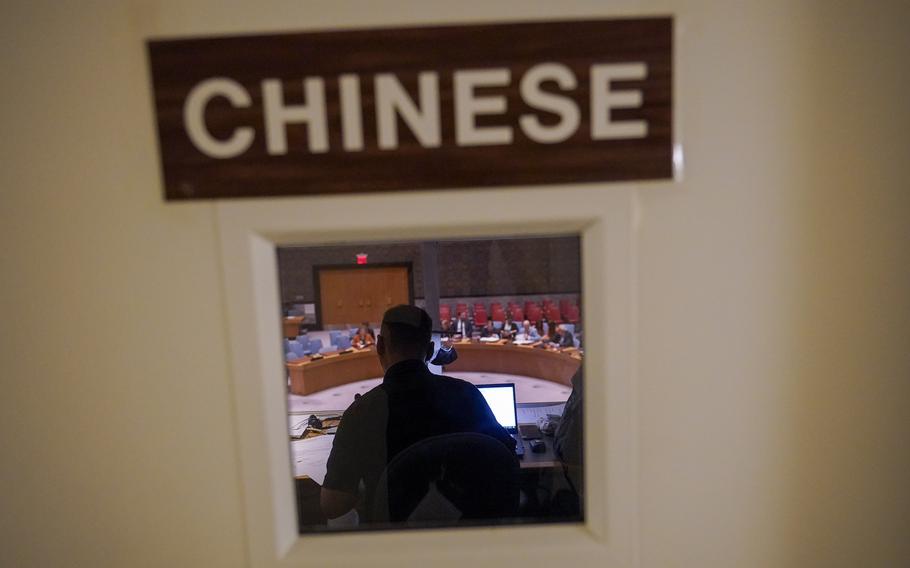 A Chinese translator works during a Security Council meeting at United Nations headquarters ahead of the General Assembly, Friday, Sept. 16, 2022. As world leaders gather in New York at the annual U.N. General Assembly, rising superpower China is also focusing on another United Nations body that is meeting across the Atlantic Ocean in Geneva.