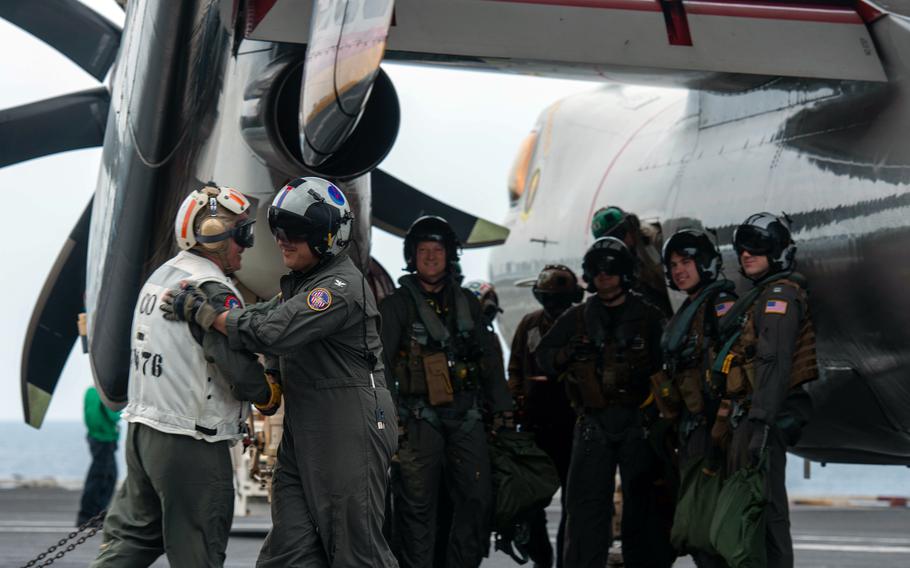 Capt. Daryle Cardone, left, congratulates Capt. Fred Goldhammer after his final flight as commander of USS Ronald Reagan, Oct. 3, 2022.