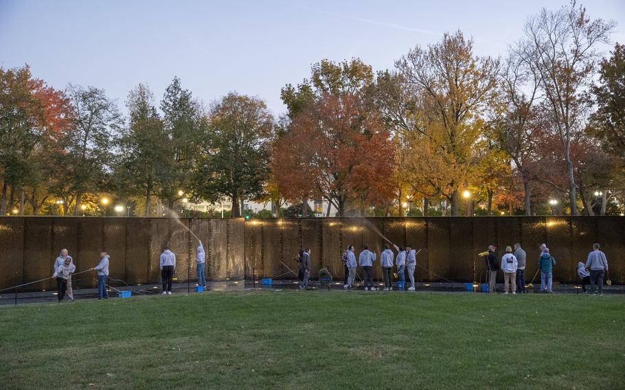 Volunteers wash Vietnam Veterans Memorial ahead of Veterans Day Stars