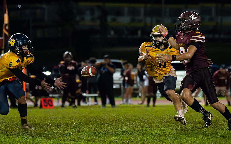 Guam High's Judah Alcantara, left, intercepts the ball late in the game.