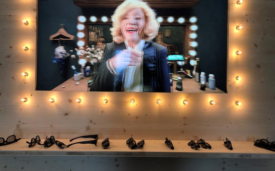 The exhibit, SHIFT, at the Kunstmuseum in Stuttgart, includes various displays related to artificial intelligence, such as this 3D film based on the idea of a re-created Marlene Dietrich.