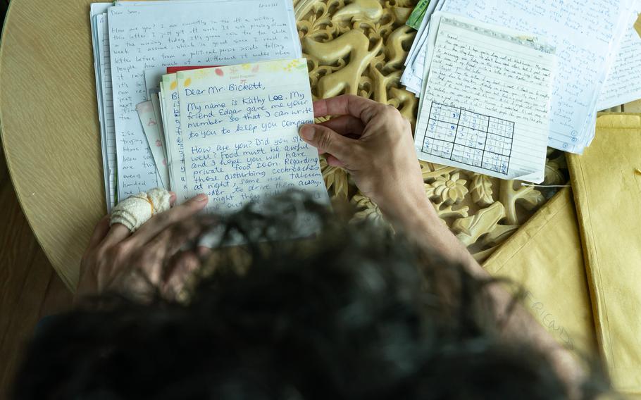 Samuel Bickett reads the letters he received during his detaining time in jail on Aug. 16, 2021 in Hong Kong. 