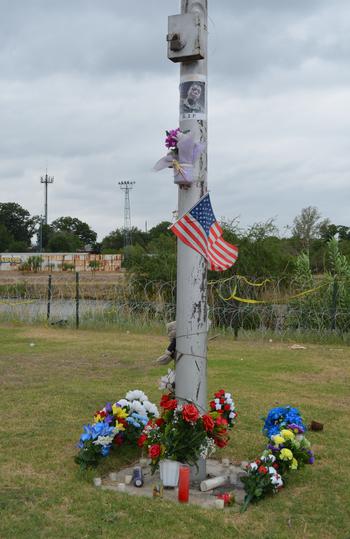 A memorial to Texas National Guard Sgt. Bishop Evans is seen along the Rio Grande in Eagle Pass, Texas, on May 23, 2022. Evans died April 22, 2022, when he tried to save migrants struggling in the water as they attempted to cross the river. 