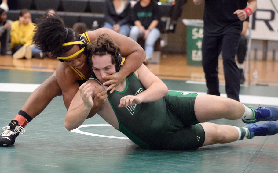 Kadena 215-pounder Jeremiah Drummer gains control of Kubasaki's Anthony Castle during Wednesday's Okinawa wrestling dual meet. Drummer won by technical fall 10-0 in 1 minute, 49 seconds and the Panthers won the meet 34-28 to go 4-0 over the Dragons on the season.