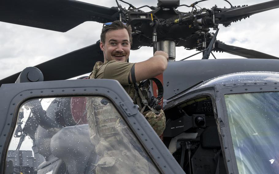 Senior Airman Logan Staib performs maintenance on an HH-60W Pave Hawk during an exercise at Avon Park, Fla., July 23, 2022. 