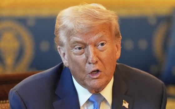 President Donald Trump speaks during a meeting.