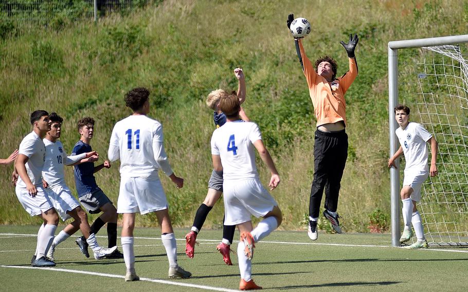 Brussels goalkeeper Liam Richard jumps up to corral a corner kick during the second day of pool-play action against Ansbach at the 2025 Division III DODEA European championships on May 20, 2025, at Rothenborn Stadion in Landstuhl, Germany.