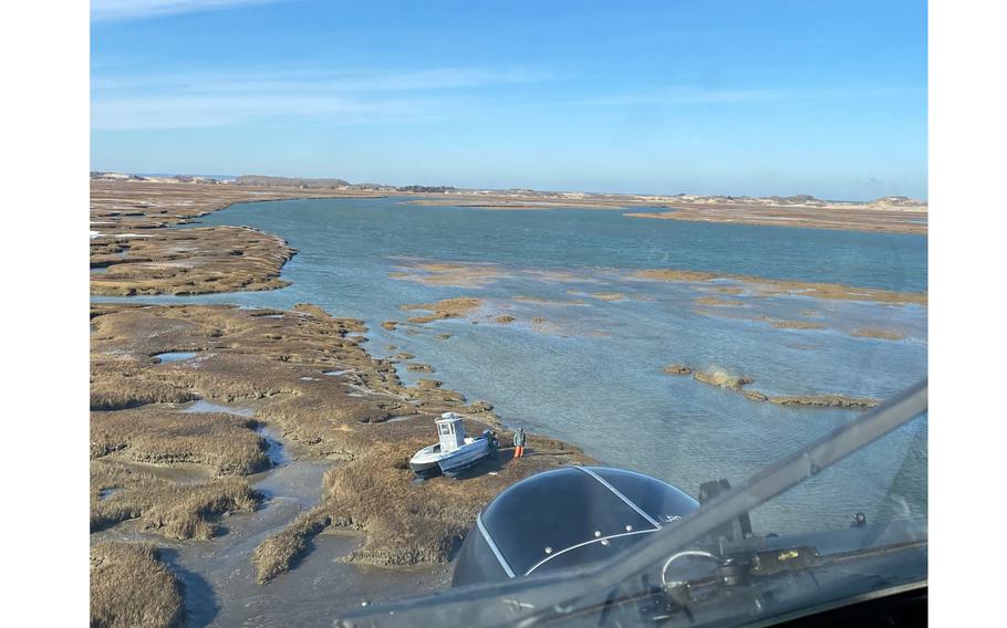 Coast Guard Air Station Cape Cod’s Jayhawk crew rescued six stranded duck hunters from a marsh near Barnstable Harbor, Mass., on Jan. 15, 2022. The hunters became stranded when their vessel was left high and dry after the tide went out.
