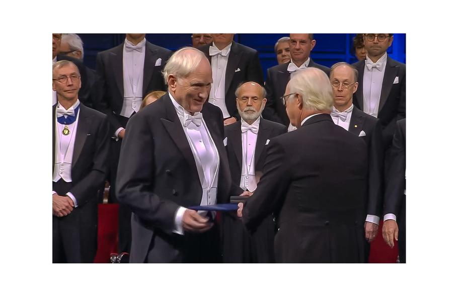 Nobel Prize in physics laureate John Clauser receives his award from Carl XVI Gustaf, the King of Sweden, during a December 2022 ceremony in Stockholm. 